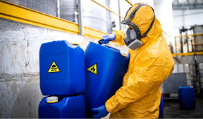Worker handling specialty chemical containers